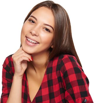 Girl smiling at the camera with hand on her chin and wearing silver braces